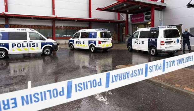 Police cars stand on the blocked grounds of the Hermanni shopping centre in Kuopio, Finland, after an attack occurred on the premises of the Savo Vocational College