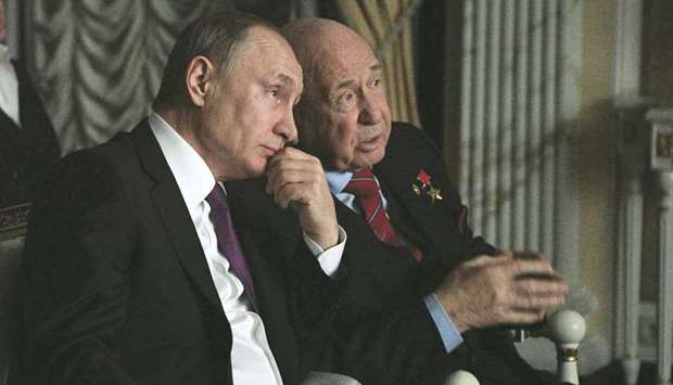 In this file photo taken on April 11, 2017, Russian President Putin speaks with Leonov during a screening of the film The Spacewalker in Moscow.