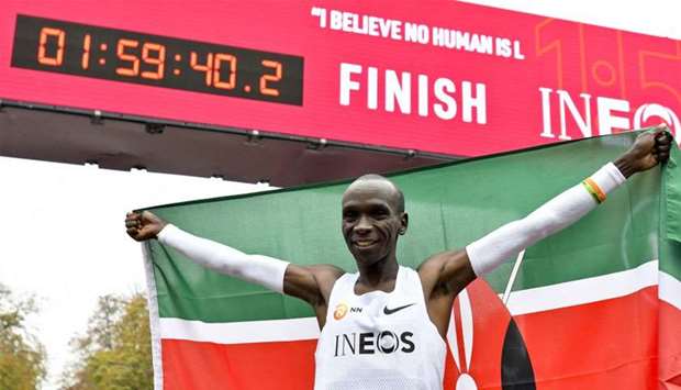 Kenya's Eliud Kipchoge celebrates in the finish area of a special course after busting the mythical two-hour barrier for the marathon