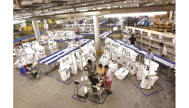 Packages are sorted for distribution at the Amazon Inc fulfilment centre in Bengaluru, India. One of the most successful Silicon Valley-Asia venture capital firms is counting on the humble mom-and-pop store that dominates Indiau2019s retail  landscape to hold its own against Amazon.com Inc and Walmart Inc.