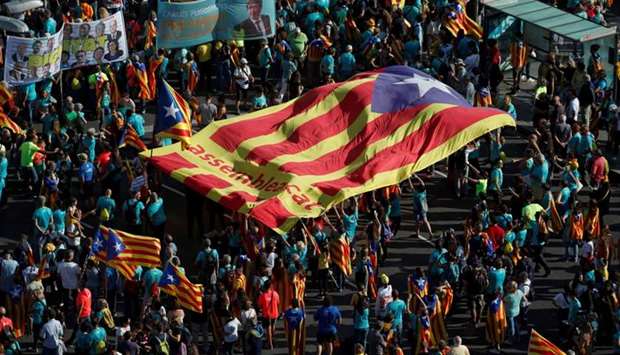 People hold a giant ,Estelada, (Catalan separatist flag) at a rally during Catalonia's national day 'La Diada' in Barcelona, Spain on September 11, 2019. R
