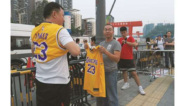 Fans wearing LeBron James jerseys are seen before the pre-season NBA game between Los Angeles Lakers and Brooklyn Nets in Shenzhen, China, yesterday. (Reuters)
