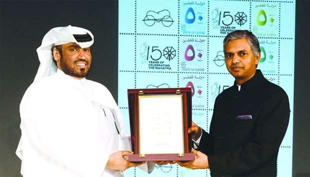 Qatar Post COO Hamad Mohamed al-Fahida and Indian ambassador P Kumaran releasing the postal stamp.rn