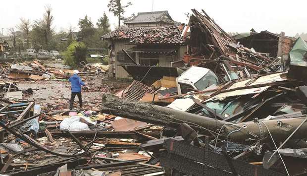 Damaged houses caused by weather patterns from Typhoon Hagibis are seen in Ichihara, Chiba prefecture, yesterday.