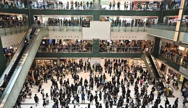 People attend a flash mob rally inside a shopping mall in the Sha Tin district in Hong Kong