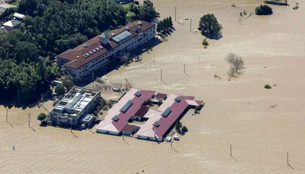 his aerial view shows the flooded Kawagoe Kings Garden nursing home besides the Oppegawa river in Kawagoe, Saitama prefecture today, one day after Typhoon Hagibis swept through central and eastern Japan