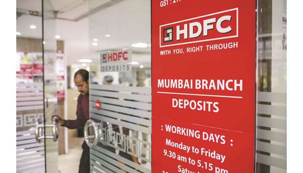 A customer exits a branch of HDFC Bank in Mumbai. Investors keep piling into HDFC Banku2019s stock, convinced it will emerge a winner from Indiau2019s financial woes.