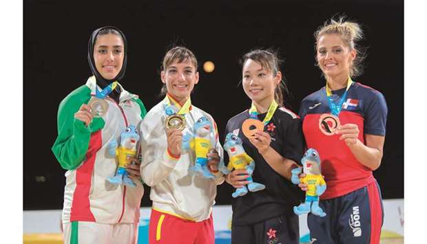 Gold medallist Damian Quintero of Spain (2nd from left), runner-up Yi Ta Wang (1st left) and joint bronze winners Gakuji Tozaki of the USA (3rd left) and  Antonio Diaz of Venezuela pose on the podium.