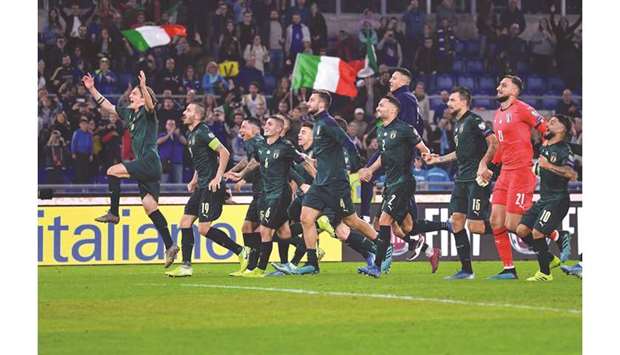 Italyu2019s players celebrate after winning the UEFA Euro 2020 Group J qualifier match against Greece at the Stadio Olimpico stadium in Rome on Saturday night. (AFP)