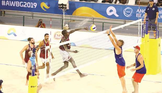 Qataru2019s Cherif Younousse spikes the ball against the USA at the Gharafa Sports Club yesterday. PICtu