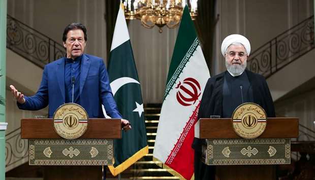 Pakistan Prime Minister Imran Khan speaks during a news conference with Iranian President Hassan Rouhani in Tehran, yesterday.