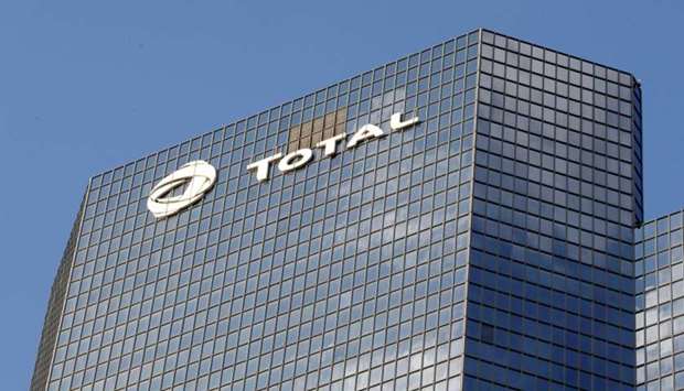 A logo of French oil company Total is seen at an office building in La Defense business district in Courbevoie near Paris, France