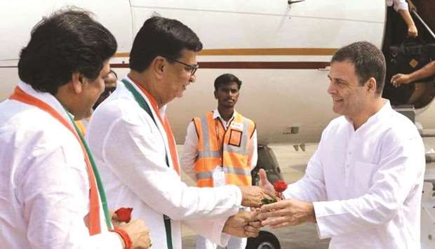 Congress leader Rahul Gandhi is welcomed by Maharashtra Congress president Balasaheb Thorat and party leader Ashok Chavan as he arrives in Latur yesterday.
