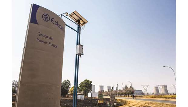 A sign stands outside the entrance road to Eskomu2019s Grootvlei coal-fired power station in Mpumalanga, South Africa (file). Eskom owes $30bn debt and isnu2019t generating enough cash to pay the interest.