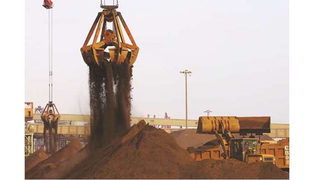 Cranes unload imported iron ore from a ship at a port in Rizhao, China. Iron ore, the key ingredient used to make steel, comes in many different types that vary by the percentage of iron content and the presence of unwanted impurities such as alumina and silica.