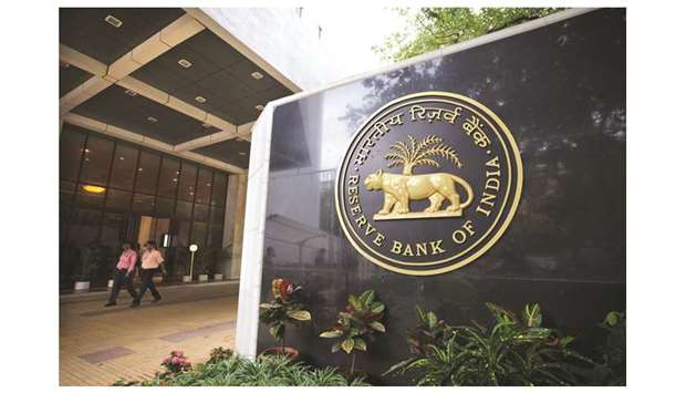 Reserve Bank of India signage is displayed at the entrance to the banku2019s headquarters in Mumbai. More rate cuts from Asiau2019s most accommodative central bank this year will help Indiau2019s sovereign bonds post modest gains despite the lingering fear of the government missing budget targets, according to the median estimates in a Bloomberg survey of 12 traders and fund managers.