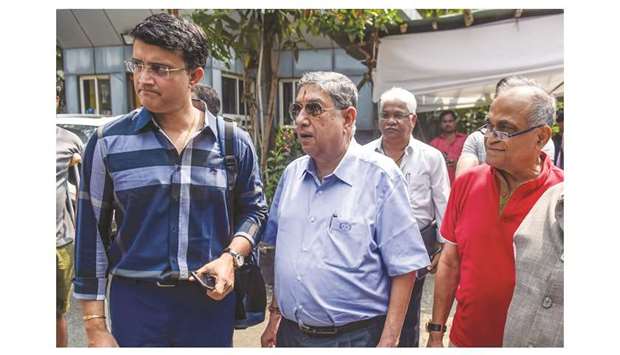 Former India cricket captain Sourav Ganguly (left), former BCCI president N Srinivasan (second left) and former BCCI secretary Niranjan Shah (right)  arrive at the BCCI headquarters at Wankhede stadium to file nomination for the boardu2019s elections in Mumbai, India, yesterday. (AFP)