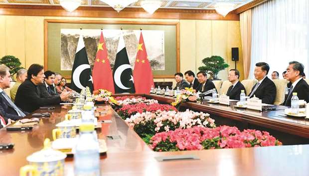 Undeterred: Prime Minister Imran Khan, with Army Chief General Qamar Javed Bajwa sitting next to him, making a point to Chinese President Xi Jinping during his visit to China last week.
