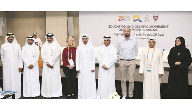 HE the Assistant Chief of the Amiri Diwan Sheikh Saoud bin Abdulrahman al-Thani (fourth right), Secretary-General of the Qatar Olympic Committee Jassim Rashid al-Buainain (fifth right) with other dignitaries during the seminar yesterday.