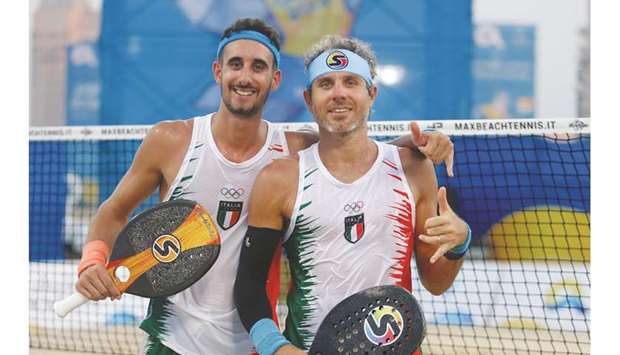 Italyu2019s Alessandro Calbucci and Michele Cappelletti pose after their win over Russiau2019s Nikolai Gurev and Ivan Syrov in the menu2019s doubles beach tennis yesterday.