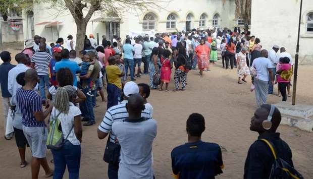People queue to cast their votes during the presidential, legislative and provincial elections in Maputo, Mozambique