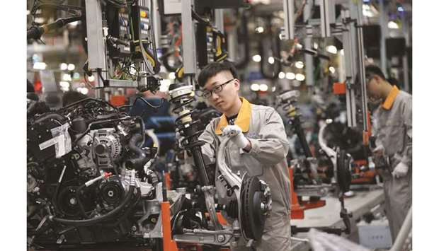 A Chinese employee working on a production line of automobiles at a factory in Changchun, Jilin province. China this week reported weaker-than-expected import and export figures for September after Washington imposed new tariffs that month, triggering a tit-for-tat response from Beijing.