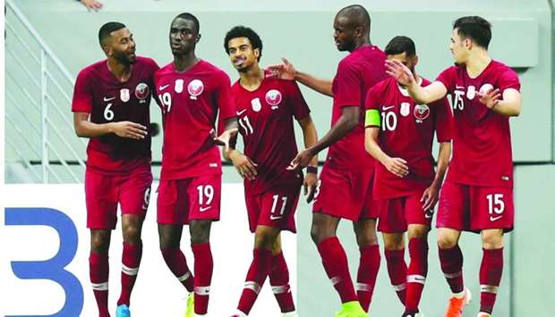 Qatar's Ali Almoez celebrates scoring their second goal with team mates. REUTERS/Ibraheem Al Omari