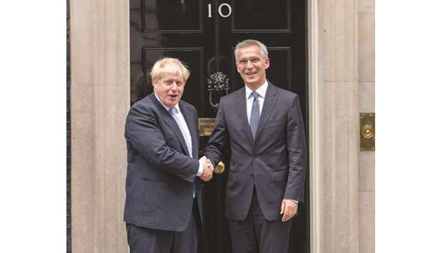 Prime Minister Boris Johnson welcomes Nato secretary general Jens Stoltenberg to 10 Downing Street in London yesterday.