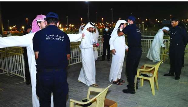MoI officials conducting a security screening at Al Janoub stadium for the match between Qatar and Oman.
