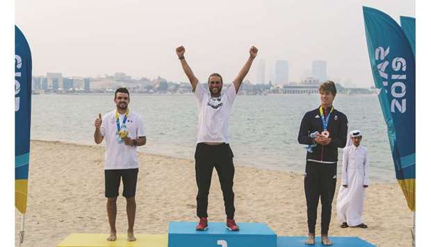(From left) Silver medallist Nicolas Parlier of France, gold medallist Florian Gruber of Germany and bronze medallist Guy Bridge of Great Britain pose during the medals ceremony for the menu2019s Kitefoil Racing event at ANOC World Beach Games yesterday. (Laurel Photo Services)