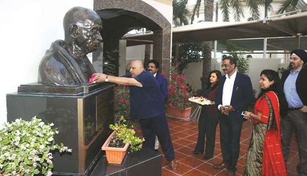 Shujaat Husain Khan pays floral tributes at the statue of Mahatma Gandhi at the Indian embassy in Doha yesterday. PICTURE: Anas Khalid