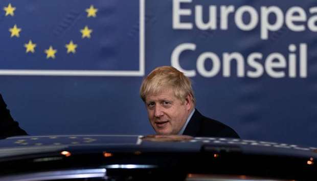 British Prime Minister Boris Johnson leaves an European Union Summit at European Union Headquarters in Brussels