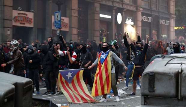 Catalan demonstrators protest during Catalonia's general strike in Barcelona