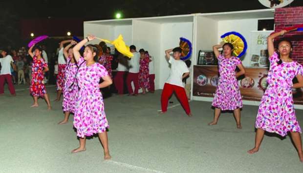 Students of Philippine International School Qatar performs a festival street dance for the event's opening yesterday at Aspire Park.