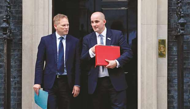 Britainu2019s Transport Secretary Grant Shapps (left) and Conservative MP and Minister of State for the Northern Powerhouse, Jake Berry leave 10 Downing Street in central London yesterday after a meeting of the cabinet.
