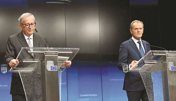 Juncker and Tusk at their joint news conference at the end of the European Union leaders summit in Brussels.