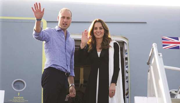 William and Kate wave goodbye before their departure at Islamabad airport.