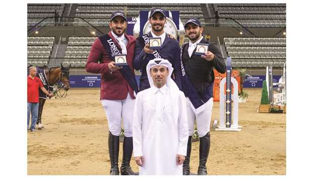 Omar al-Mannai (front), Vice-Chairman of Organising Committee Longines Hathab, poses with Medium Tour winner Hussain Saeed Haidan (centre), runner-up Jaber Rashid al-Amri (left) and Mohamed Hazim, who finished third at the Al Shaqab Indoor Arena.