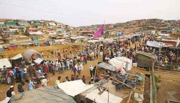 Rohingya refugees gather at a market inside a refugee camp in Coxu2019s Bazar, Bangladesh. March 13, 2019 file picture.