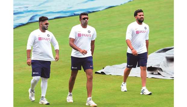 (Left to right) Indian players Rishabh Pant, Ravichandran Ashwin and Rohit Sharma walk during a practice session on the eve of the first Test against South Africa at the Dr. Y.S. Rajasekhara Reddy ACA-VDCA Cricket Stadium in Visakhapatnam yesterday. (AFP)