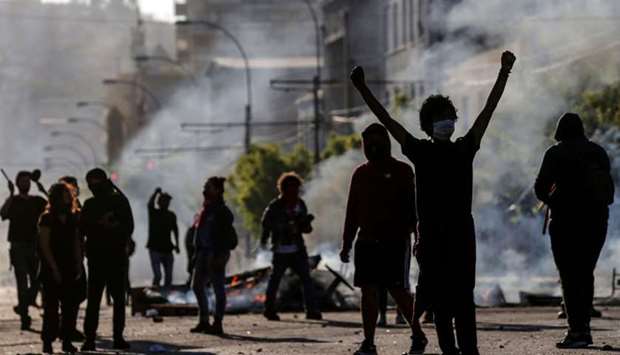 Demonstrators are seen at a barricade during protests in Valparaiso, Chile