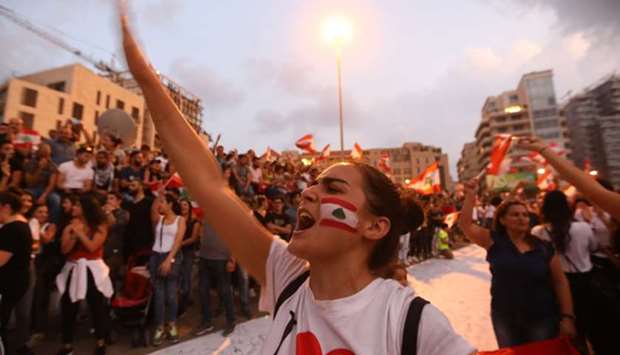 Lebanese demonstrators chant slogans as they take part in a rally in the capital Beirut's downtown district