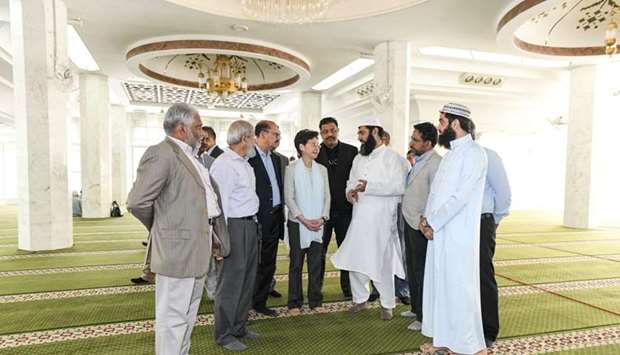 Hong Kong's Chief Executive Carrie Lam (C) visits the Kowloon Masjid and Islamic Centre in Tsim Sha Tsui to meet with representatives of the Incorporated Trustees of the Islamic Community Fund of Hong Kong and other leaders of the local Muslim community, in Hong Kong,