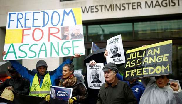Demonstrators protest outside of Westminster Magistrates Court, where a case management hearing in the US extradition case of WikiLeaks founder Julian Assange is held, in London