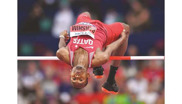 Qataru2019s Mutaz Essa Barshim leaps over the bar during the high jump qualification yesterday.