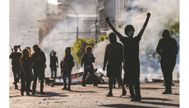 Demonstrators are seen at a barricade during protests in Valparaiso, Chile on Sunday.