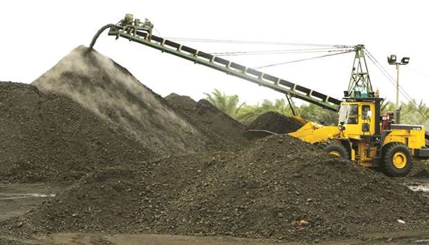 A bulldozer forms a stockpile of coal at the PT Exploitasi Energi operations in South Kalimantan, Indonesia. Bonds from the countryu2019s financially weak miners have suffered more than peers elsewhere in Asia due to a lack of diversification and state backing that many competitors enjoy.