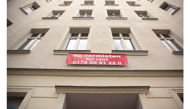 A real estate sign on a block of residential apartments advertises a flat for rent in the Mitte district of Berlin. While rentersu2019 groups in Munich are pushing for a six-year rent freeze, other German cities have yet to follow Berlinu2019s lead amid concerns that the action could complicate the development of new homes.