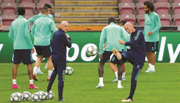 Real Madrid coach Zinedine Zidane and assistant coach David Bettoni during a training  session yesterday.