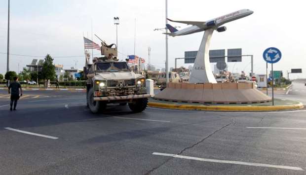 A convoy of US vehicles is seen after withdrawing from northern Syria, in Erbil, Iraq